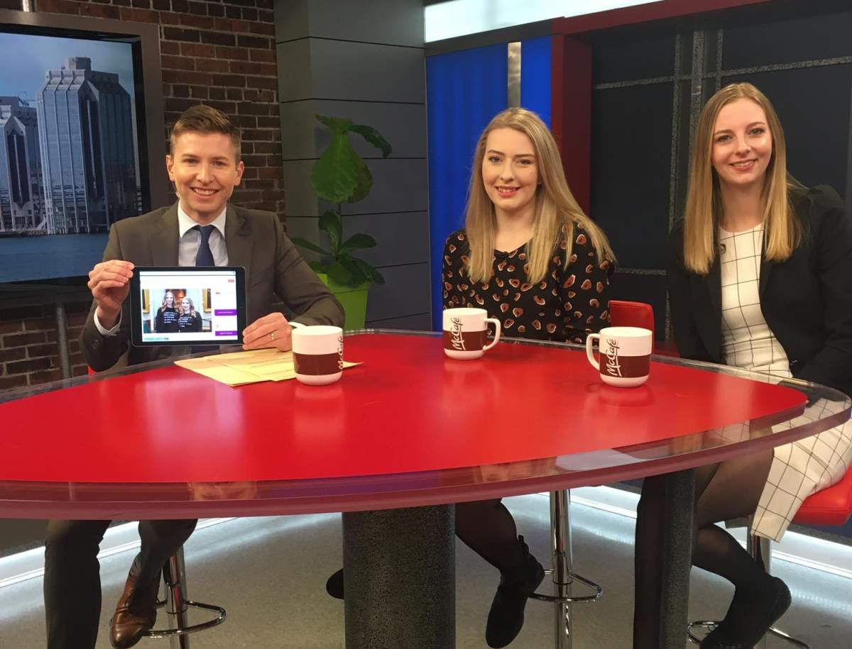 Global News Morning host Paul Brothers poses with Grace Evans and Sarah Dobson of On Their Shoulders: Women in Nova Scotia Politics on March 5, 2020.
