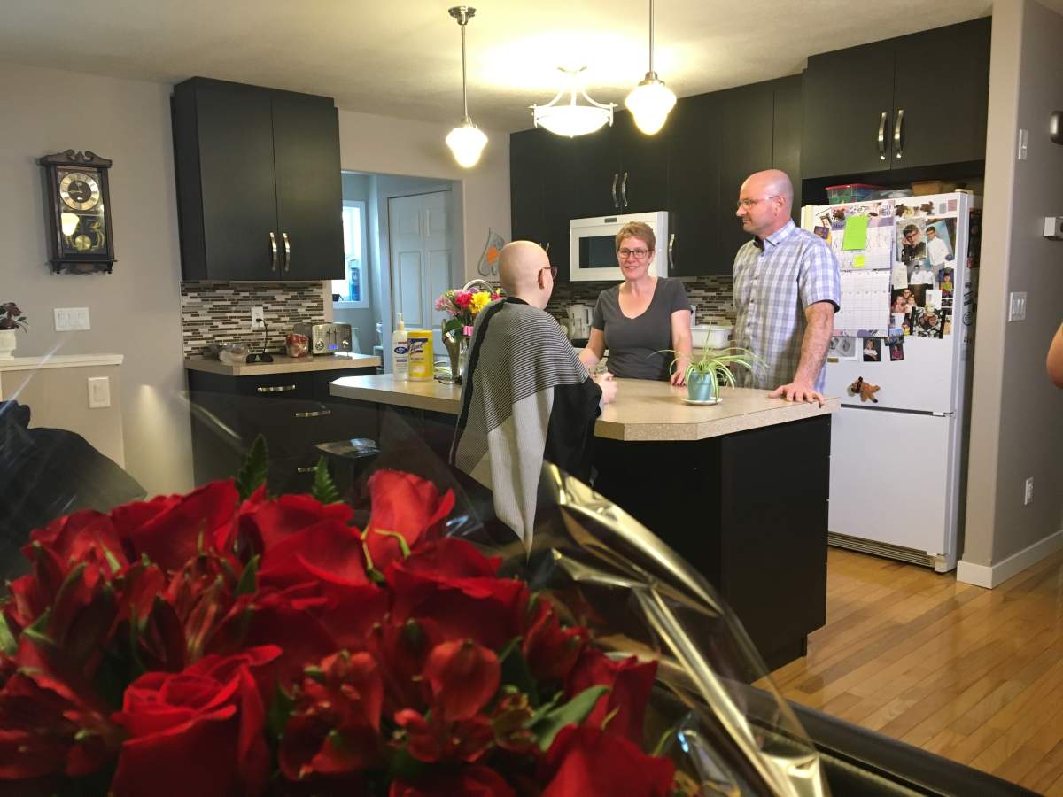 Alysha with her parents Michelle and Ken.