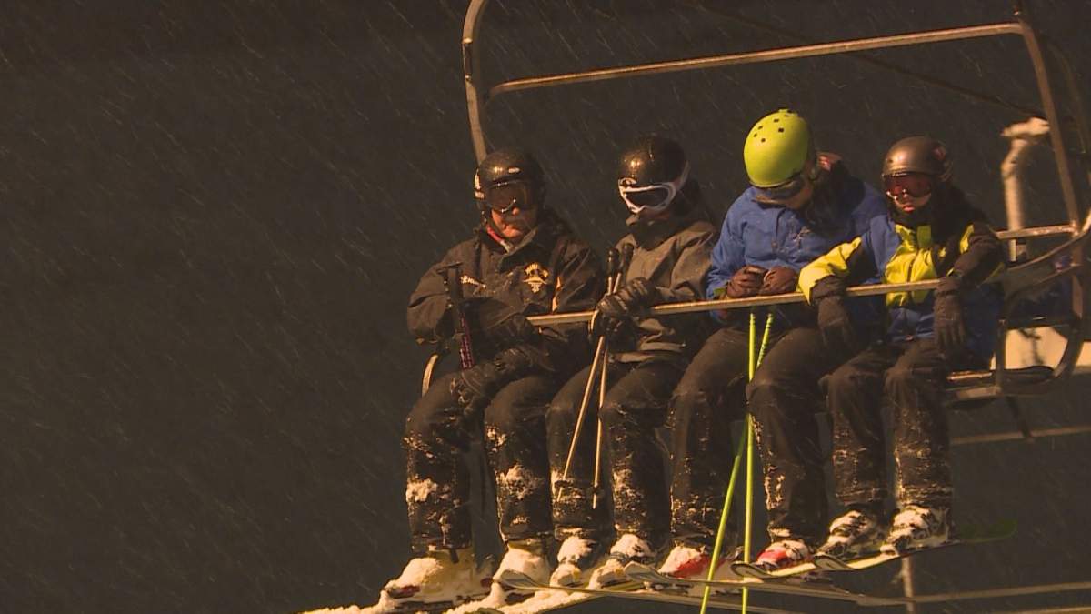 Ron Struch on the chair lift with some of his athletes.