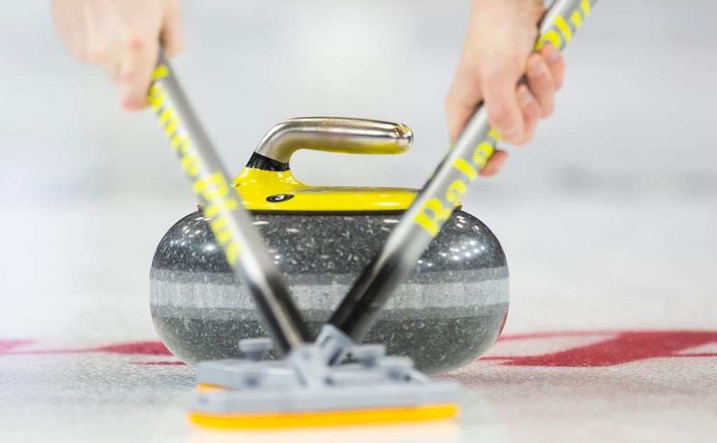 Members of team P.E.I. sweep their rock during the 9th draw against team Quebec at the Brier in Brandon, Man., Tuesday, March 5, 2019.