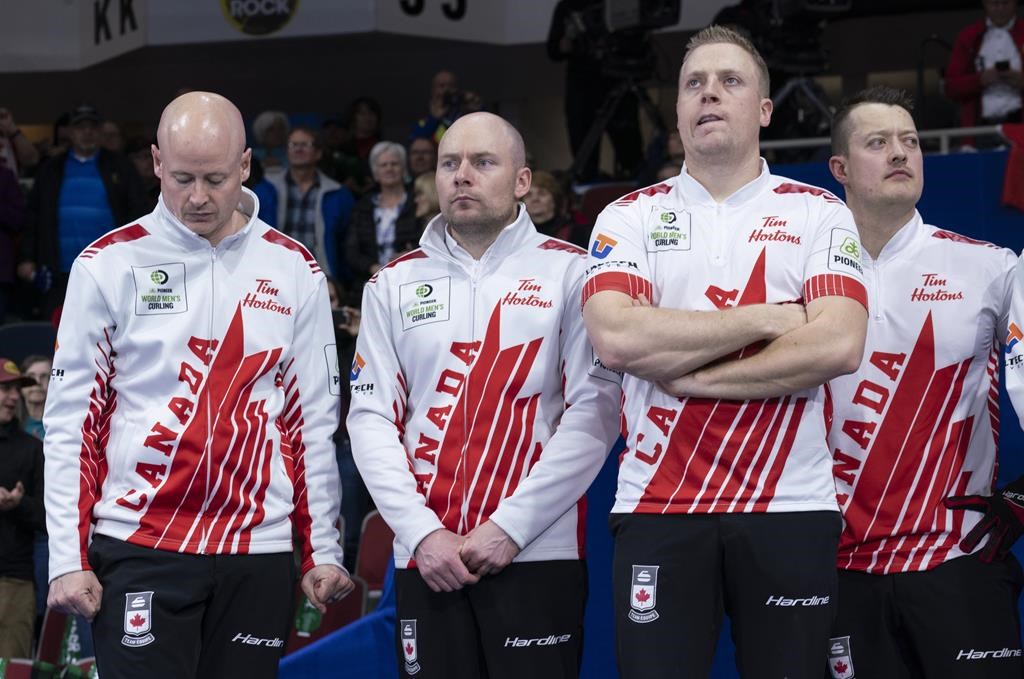 Canada skip Kevin Koe, third B.J. Neufeld, second Colton Flasch, lead Ben Hebert, left to right. THE CANADIAN PRESS/Paul Chiasson