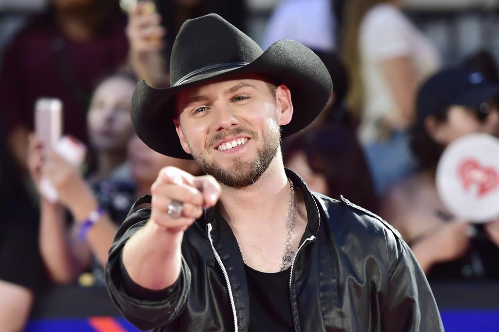 Brett Kissel arrives on the red carpet at the iHeartRadio MMVAs in Toronto on Sunday, Aug. 26, 2018. THE CANADIAN PRESS/Frank Gunn.