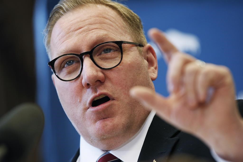 Manitoba Finance Minister Scott Fielding speaks to media at a press conference before the provincial budget is read at the Manitoba Legislature in Winnipeg on March 11, 2020. 