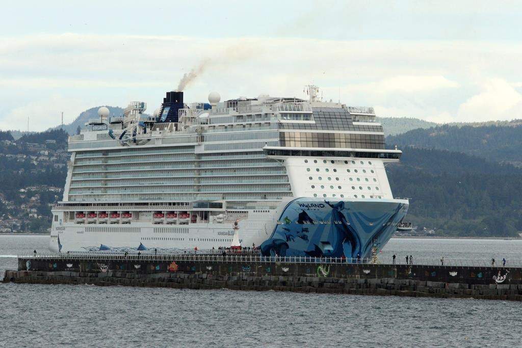 The Norwegian Bliss en route from Alaska to Seattle makes it's way towards Ogden Point in Victoria, B.C., on Friday June 1, 2018. Transport Canada's decision to suspend the cruise season until July 1 will mean 114 cancelled cruise ship arrivals and almost 300,000 fewer passengers this spring and summer, says the harbour authority's chief executive officer. THE CANADIAN PRESS/Chad Hipolito.