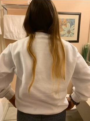 Rhonda Knight and her mother Tracy say they believe another hockey player cut her hair during a tournament in Cape Breton.