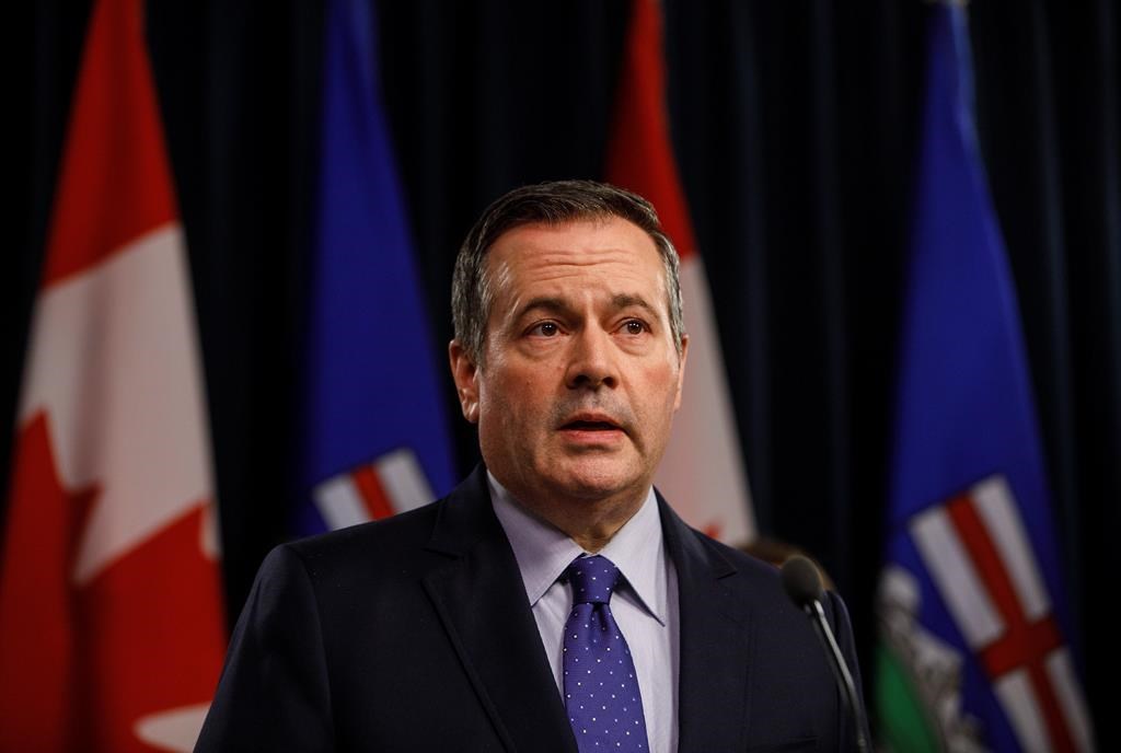 Alberta Premier Jason Kenney updates media on measures taken to help with COVID-19, in Edmonton on Friday, March 20, 2020. THE CANADIAN PRESS/Jason Franson.