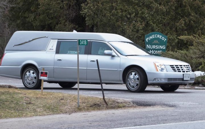 A hearse leaves with another casualty of COVID-19 at Pinecrest Nursing Home in Bobcaygeon, Ontario on Tuesday March 31, 2020.