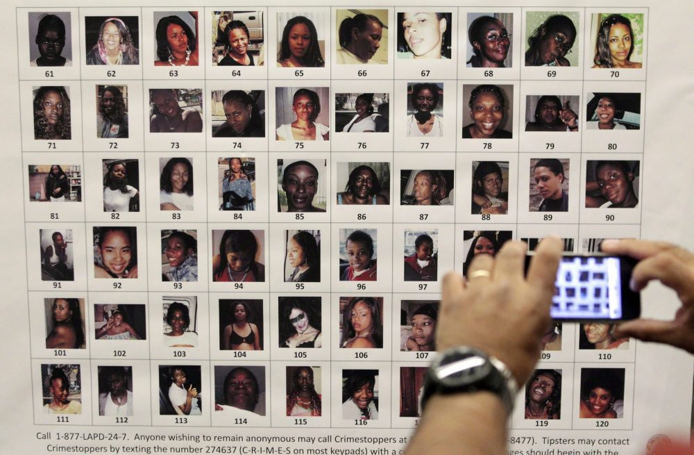 In this Dec. 16, 2010, file photo, photographs found in the possession of Lonnie David Franklin Jr. are displayed at a police news conference in Los Angeles.