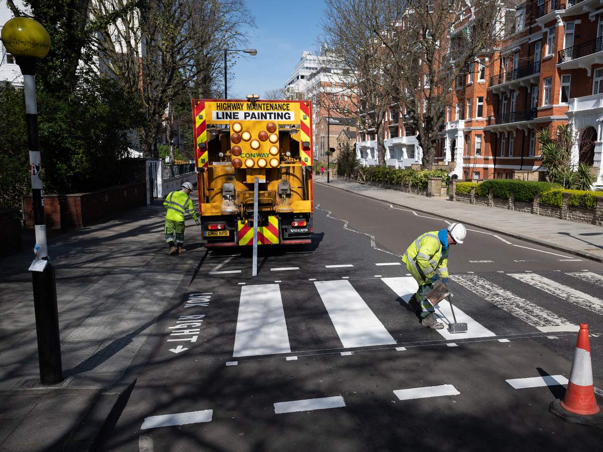 A Highways Maintenance team takes advantage of the COVID-19 coronavirus lockdown and quiet streets to re-paint the iconic Abbey Road crossing on March 24, 2020 in London, England.