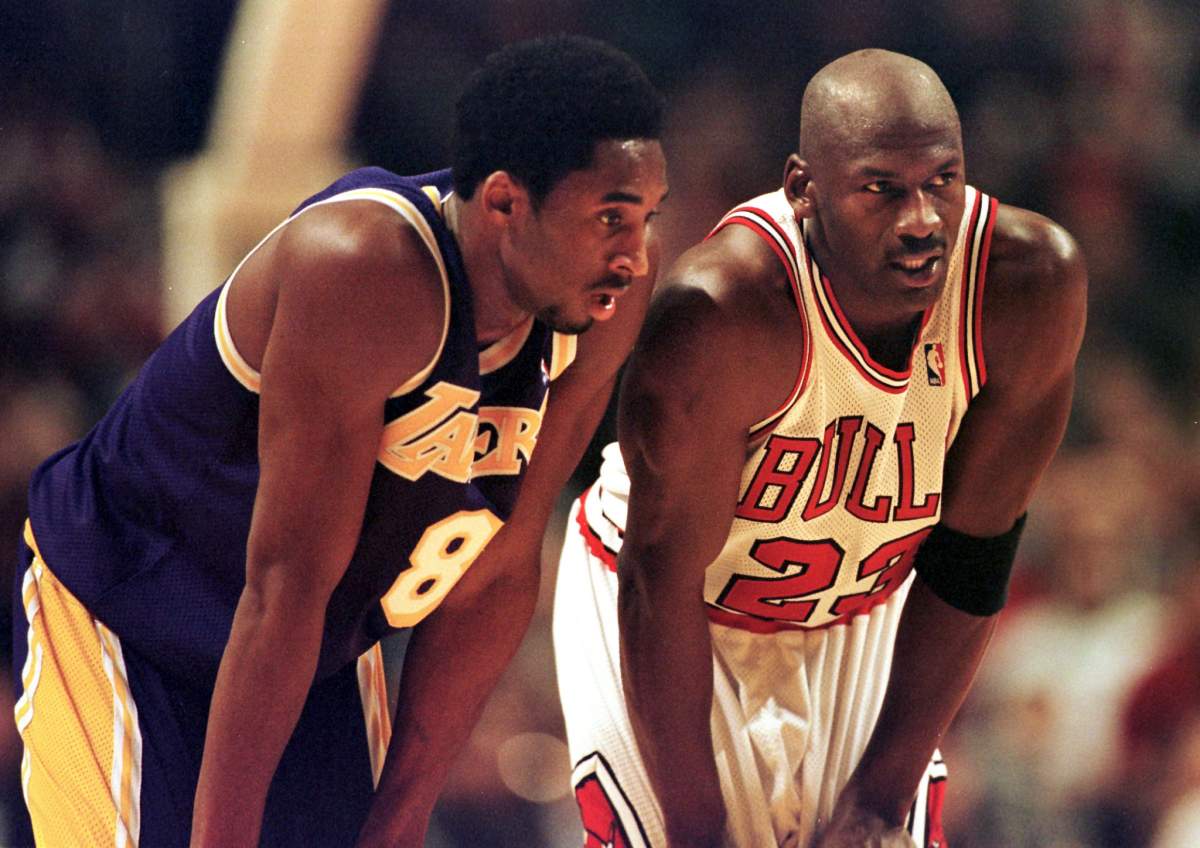 Los Angeles Lakers guard Kobe Bryant (L) and Chicago Bulls guard Michael Jordan (R) talk during a free-throw attempt during the fourth quarter of a game at the United Center in Chicago.