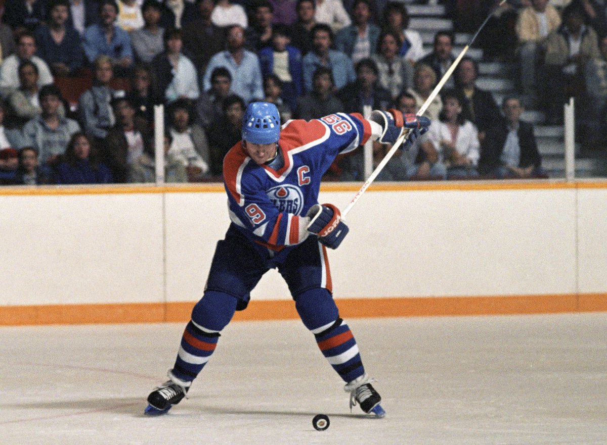 Edmonton Oilers' Wayne Gretzky winds up for a shot during the first round of playoff action against the Vancouver Canucks on April 12, 1986 in Vancouver.