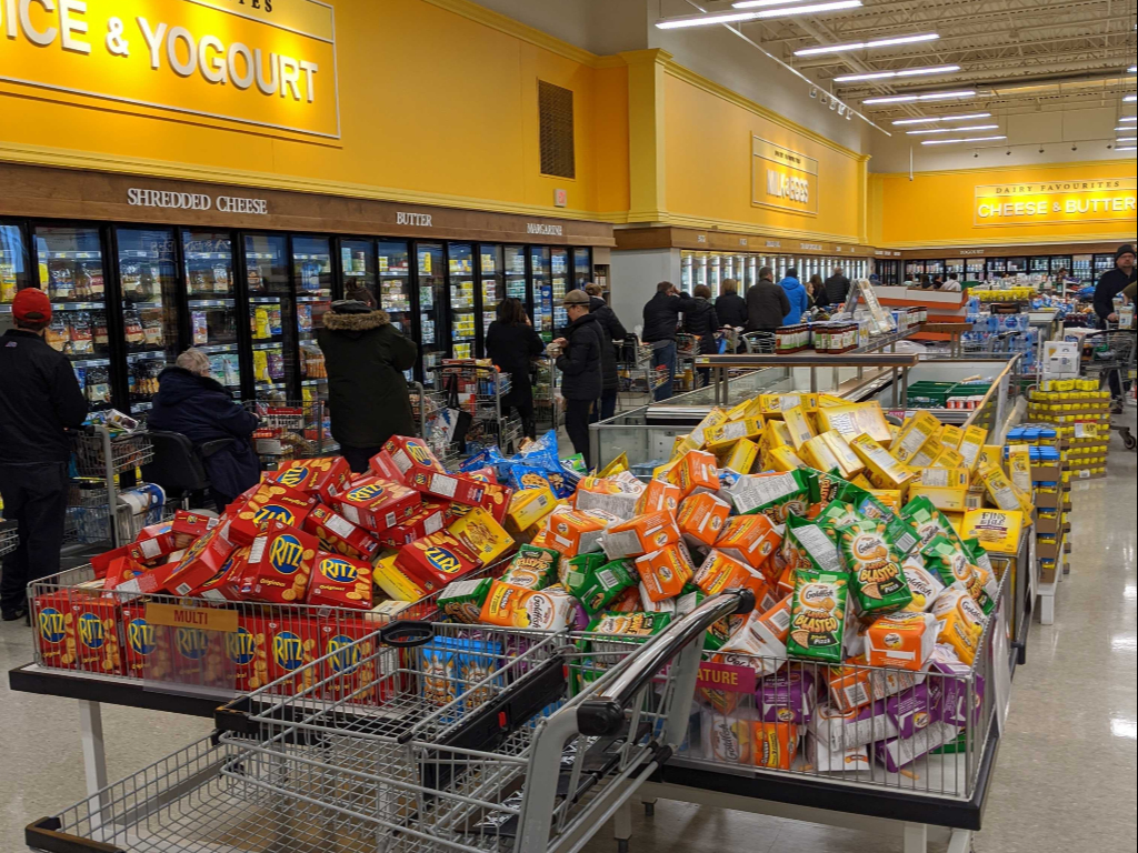 Checkout lineups stretched around the perimeter of a Guelph, Ont., grocery store.