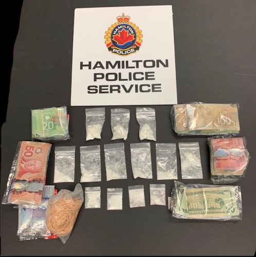 Hamilton police say they seized cash and drugs after a traffic stop near Main Street West and Norfolk Street South on March 27, 2020.