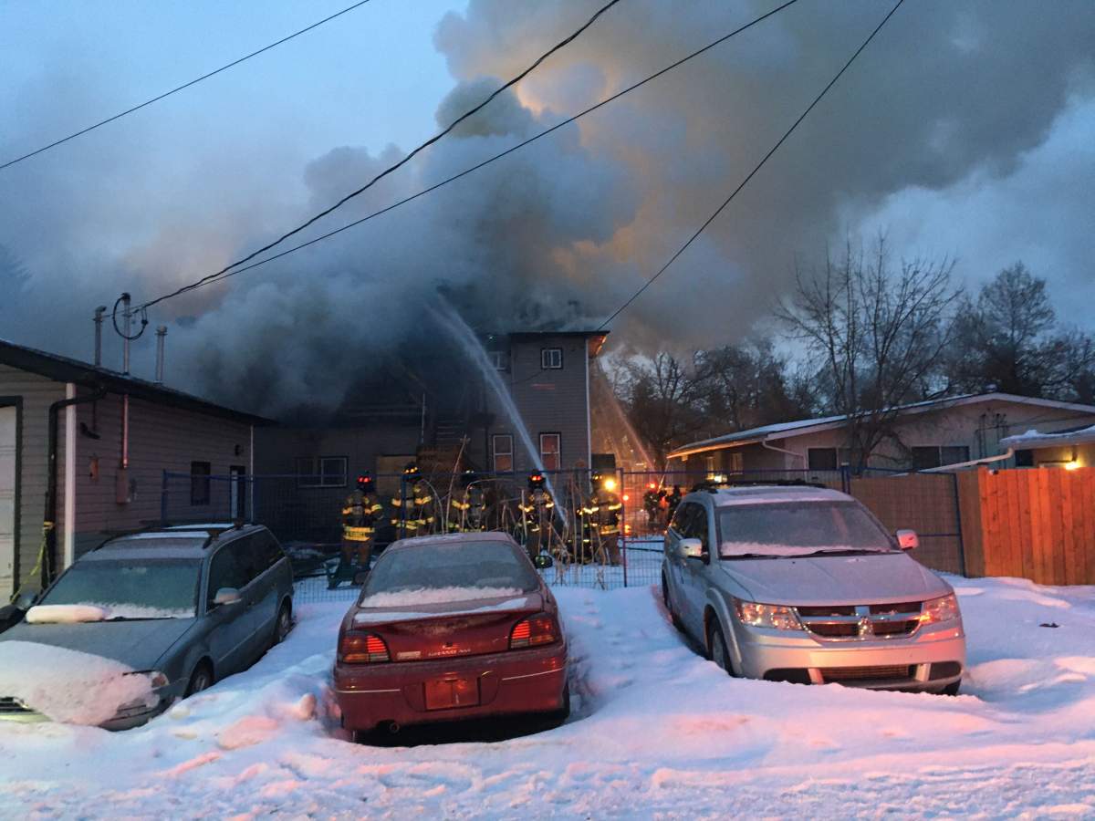Edmonton Fire Rescue Services crews working to contain a house fire at at 110 Avenue and 123 Street in west-central Edmonton’s Westmount neighbourhood. Thursday, March 12, 2020.