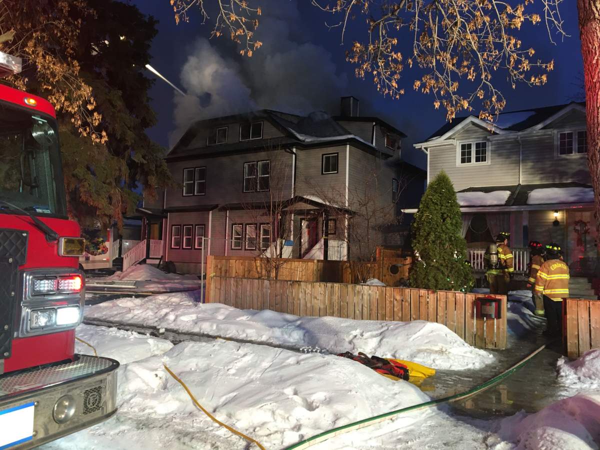 Edmonton Fire Rescue Services crews working to contain a house fire at at 110 Avenue and 123 Street in west-central Edmonton’s Westmount neighbourhood. Thursday, March 12, 2020.