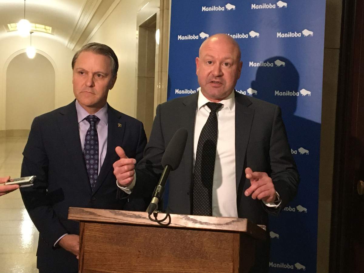 Manitoba’s chief provincial public health officer, Dr. Brent Roussin, right, and Health Minister Cameron Friesen announce the province’s plans against COVID-19 Tuesday.