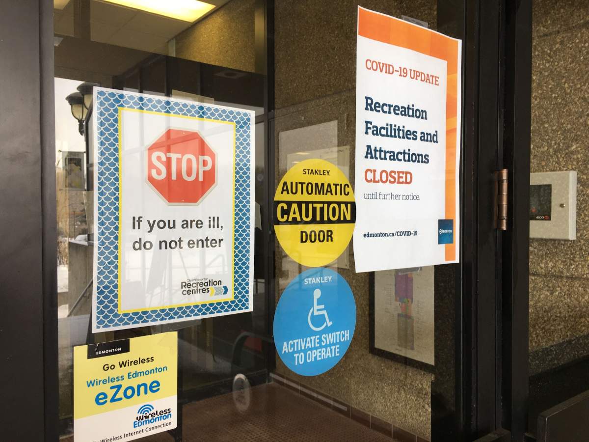 Signs posted on Saturday, March 15, 2020 at the Kinsmen Sports Centre in Edmonton stated that the city's recreation facilities and attractions were closed.