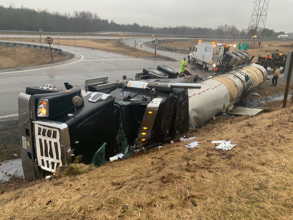 The Palace Road on- and off-ramps are closed after a tractor trailer rolled over, spilling liquid asphalt in the ditch, police say.