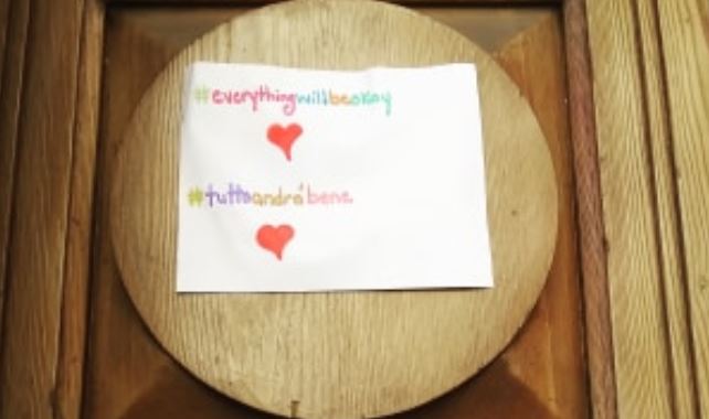 In the village of Pratola Peligna, positive signs are being posted on doors and in windows.