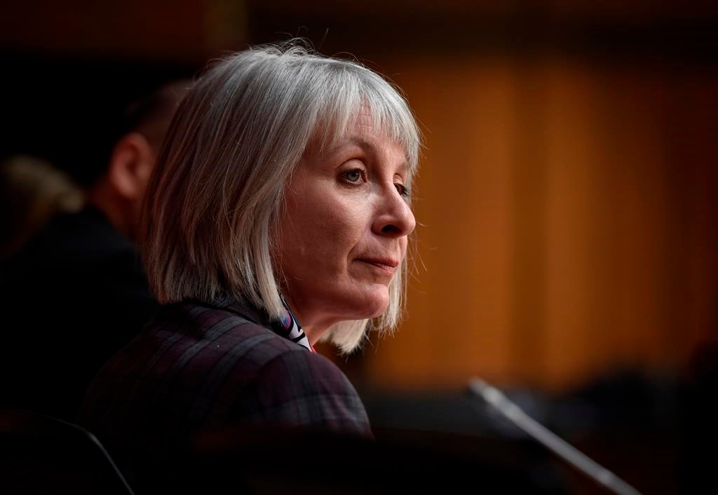 Minister of Health Patty Hajdu listens during a press conference on COVID-19 in West Block on Parliament Hill in Ottawa on Friday, March 20, 2020. THE CANADIAN PRESS/Justin Tang