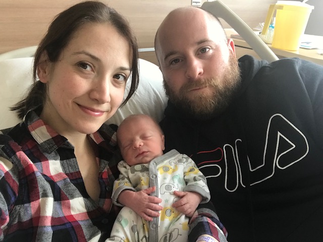 Leap year baby Milo MacKinnon and his parents.