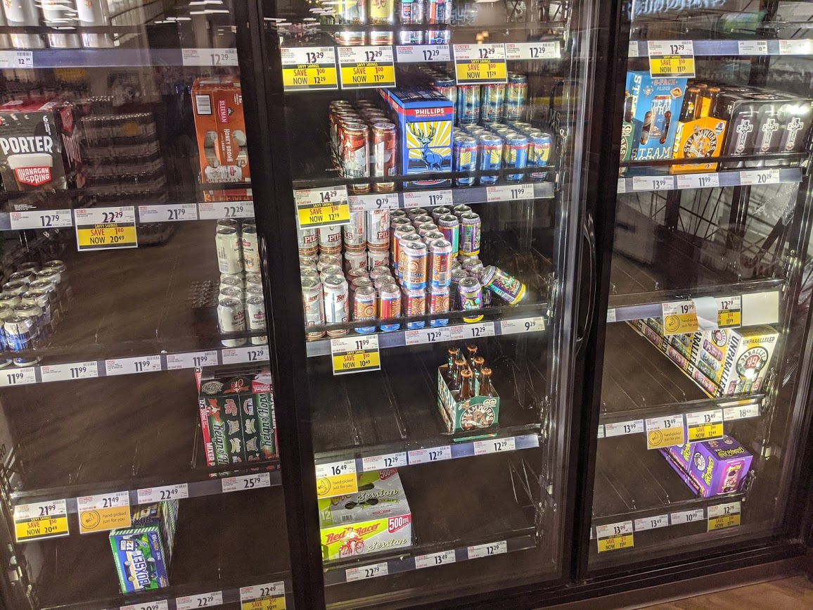 A half-empty beer fridge is seen at the BC Liquor Store on Commercial Drive in Vancouver.