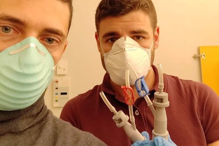 Cristian Fracassi, left, and his Isinnova colleague Alessandro Ramaioli show off their 3D-printed valves in Italy.