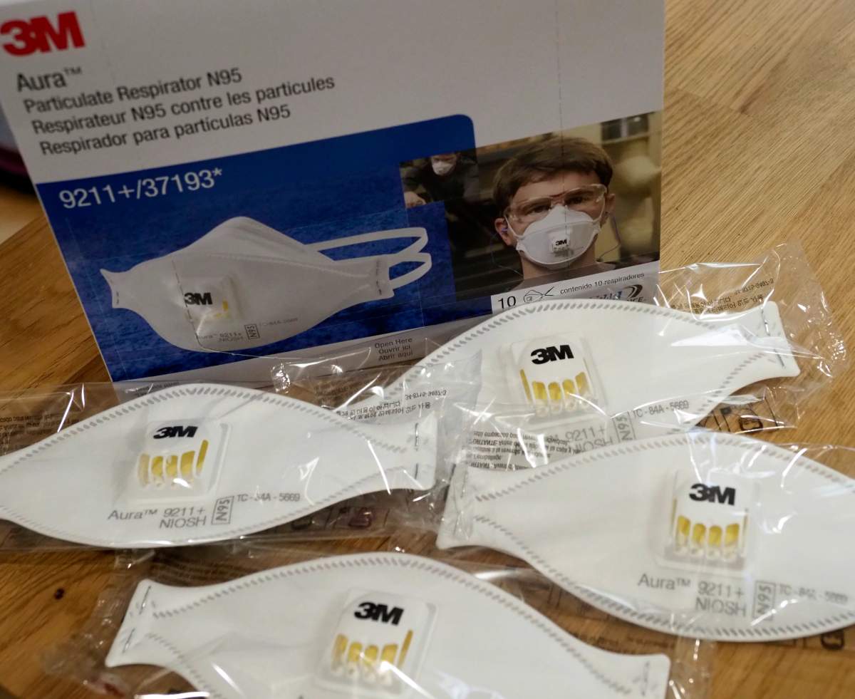 FILE PHOTO -- Particle respirators 3M N95 masks lie on a table. 