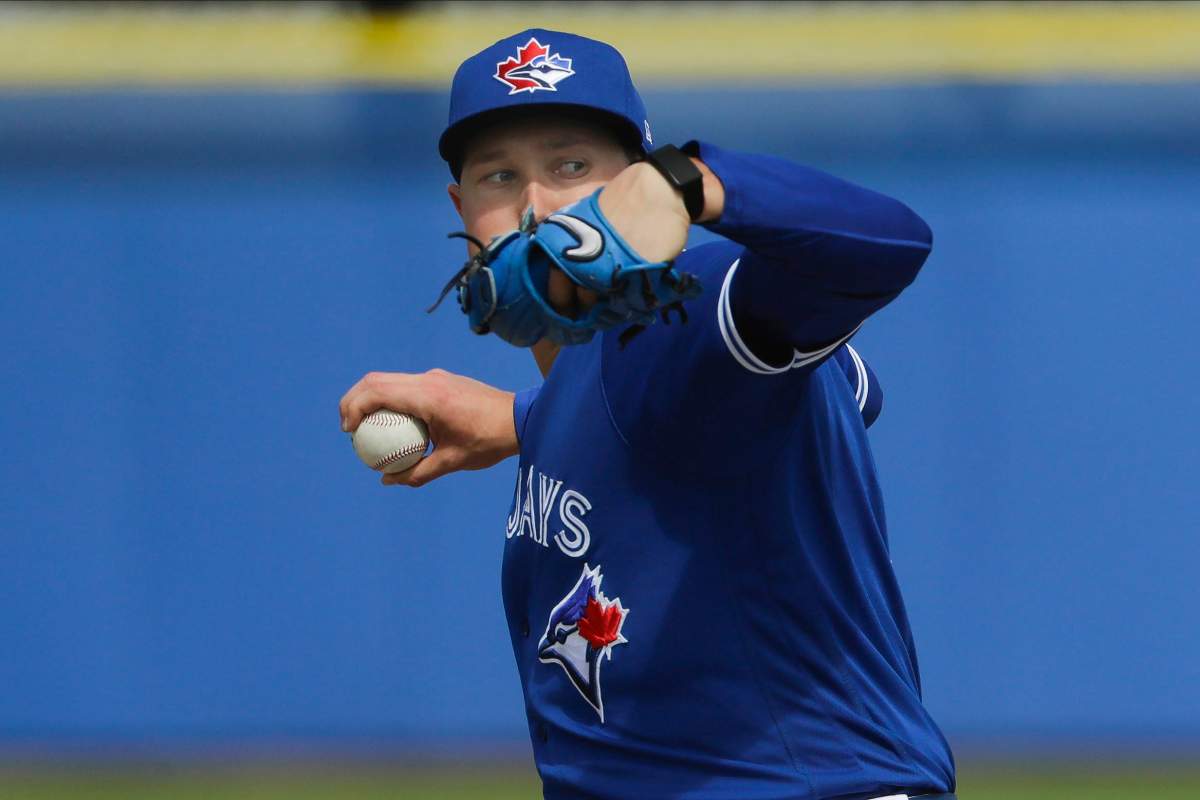 Toronto Blue Jays' Nate Pearson delivers a pitch during live batting practice at a spring training baseball workout Friday, Feb. 21, 2020, in Dunedin, Fla.
