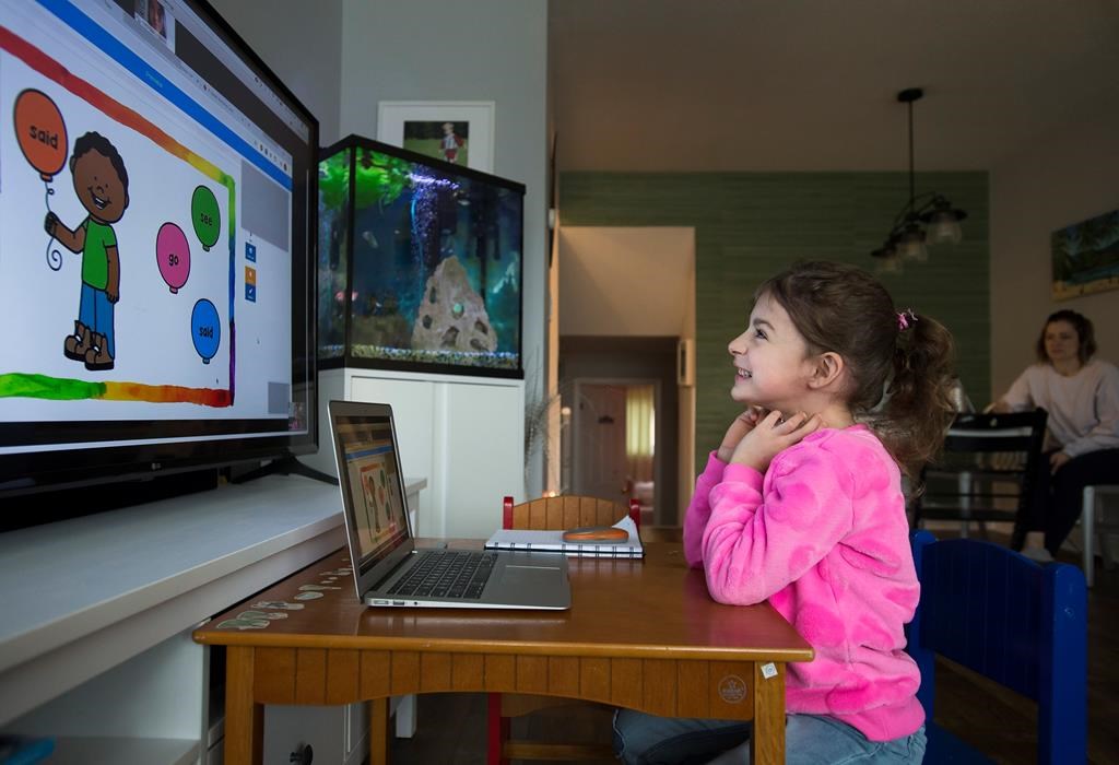 Six-year-old Peyton Denette works on her speech and language skills with speech-language pathologist Olivia Chiu of Two Can Talk remotely from her home in Mississauga, Ont., on Monday, March 30, 2020.