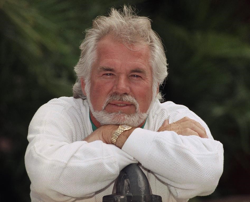 This May 17, 1989 file photo shows Kenny Rogers posing for a portrait in Los Angeles. (AP Photo/Bob Galbraith, File)
