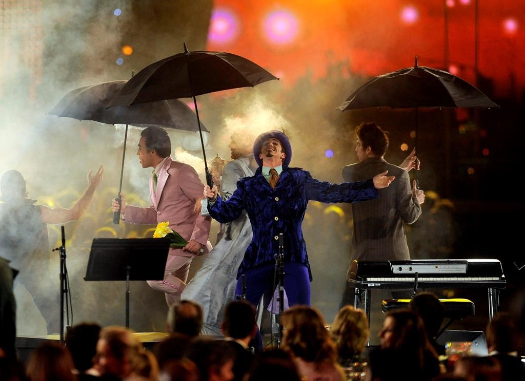 Members of the cast from The Beatles' 'LOVE' by Cirque du Soleil perform at the MusiCares Person of the Year gala honoring Paul McCartney in Los Angeles, Calif., on Feb. 10, 2012.