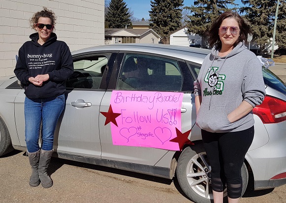 Moose Jaw residents Jody Chell (left) and Krista Antal organized nine birthday parades in their community on March 28th and 29th.
