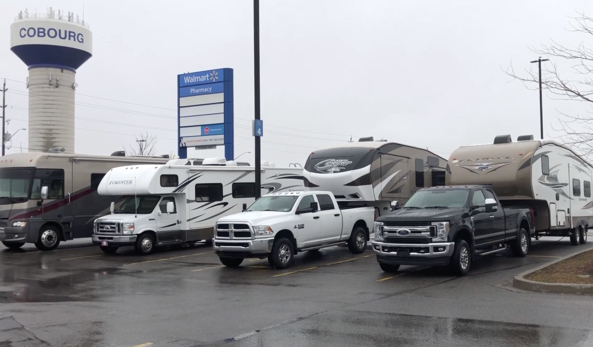 Vehicles parked outside a Walmart in Cobourg, Ont., on Monday. 