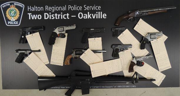 A man faces numerous charges after police seized dozens of weapons in Burlington and Stoney Creek.