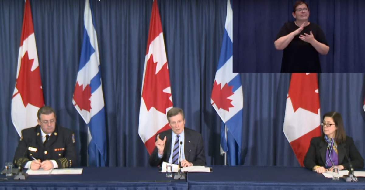 Sarah Stadnicki (top right) provides sign language interpretation at a City of Toronto COVID-19 update on March 26, 2020.