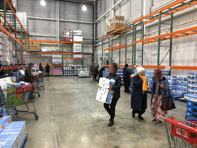 Shoppers stock up on toilet paper at a Metro Vancouver Costco over the weekend.