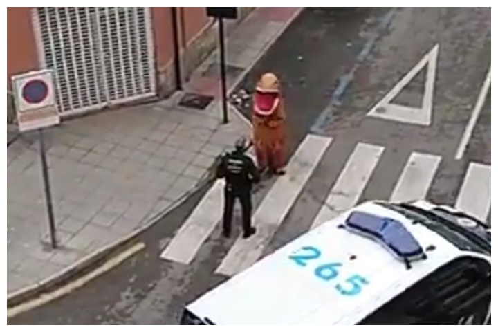 A police officer speaks to a person violating quarantine rules in Murcia, Spain, on March 16, 2020.