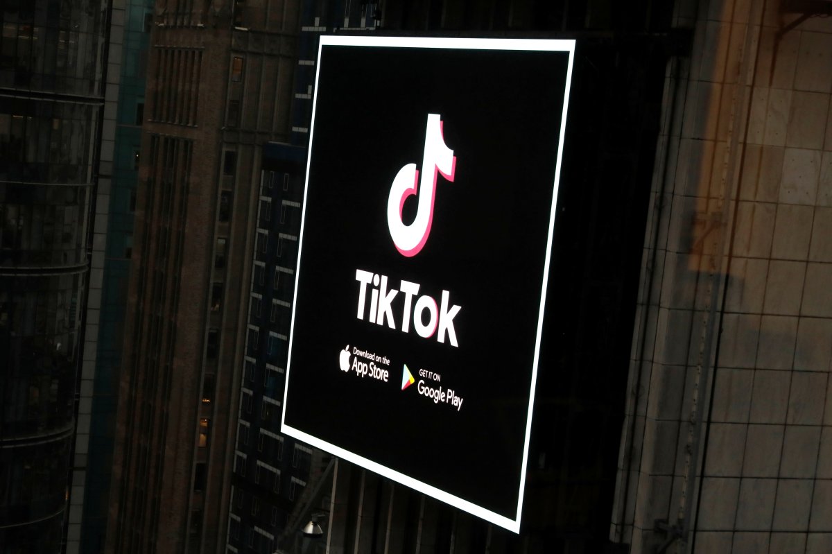 The TikTok logo is seen on a screen over Times Square in New York City, U.S., March 6, 2020. 