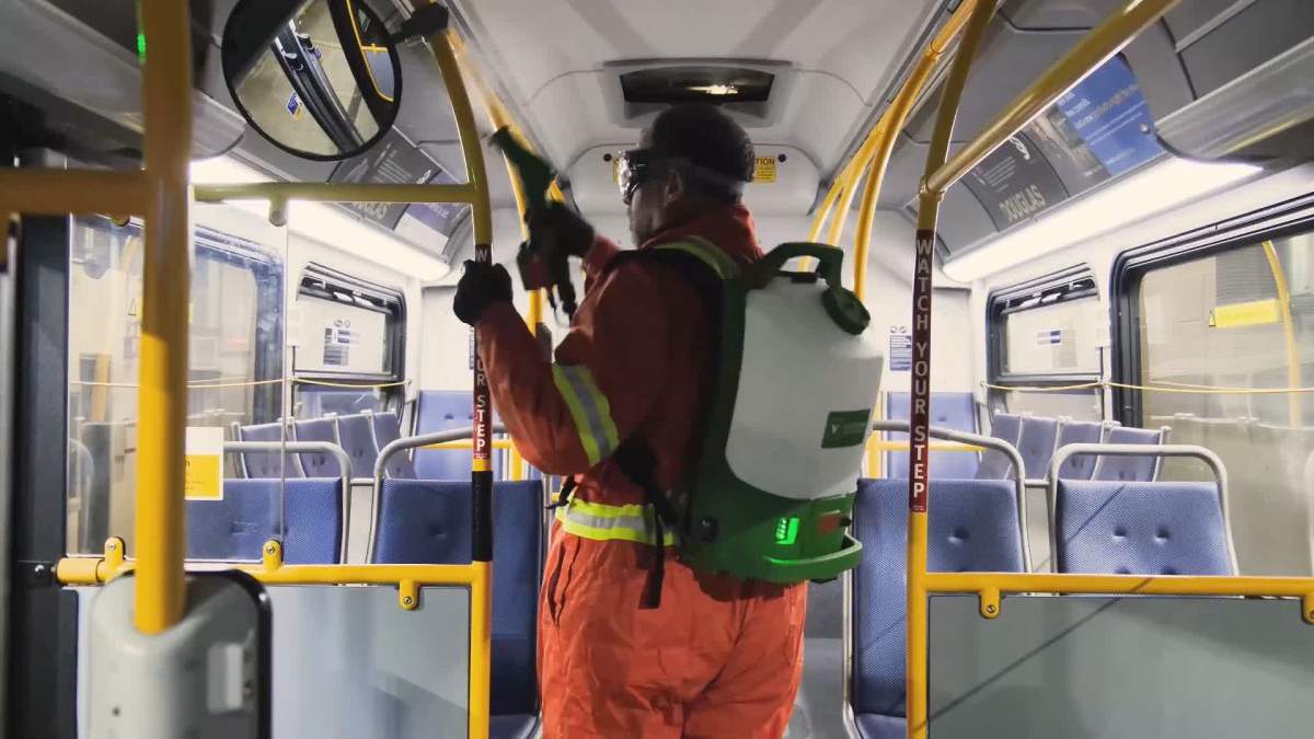 TransLink crews spray a bus with disinfectant. The transit authority says buses are now getting a weekly spray, along with regular cleaning. 