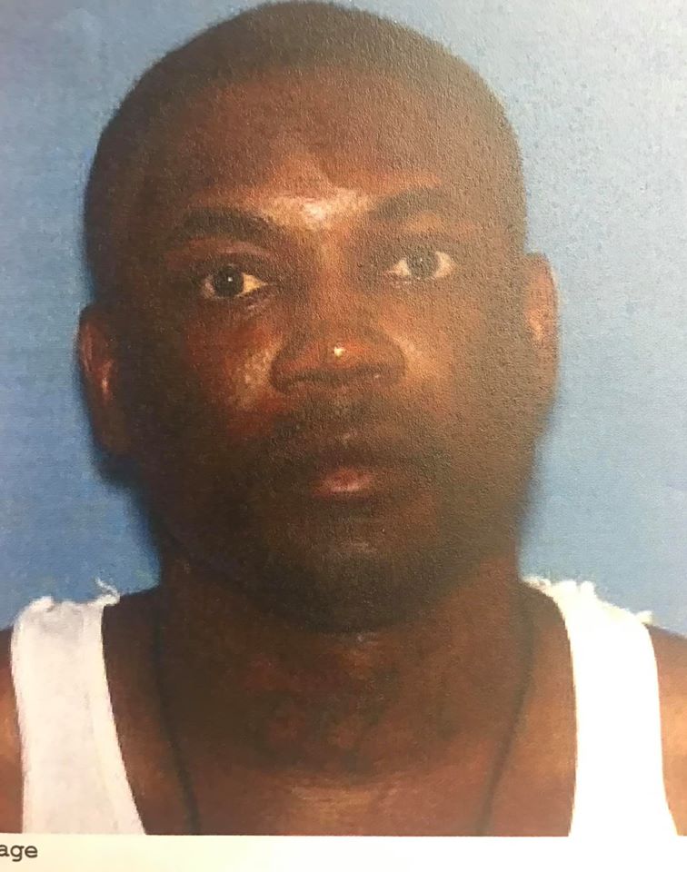 Travis Santay Lewis, 39, is shown in this handout photo.