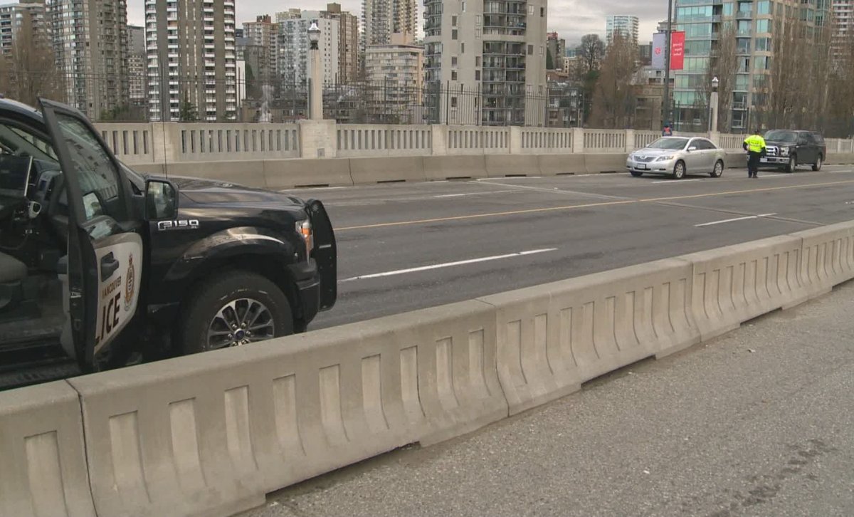 Vancouver police at the scene of a crash involving a pedestrian on the Burrard Street Bridge on March 1, 2020.