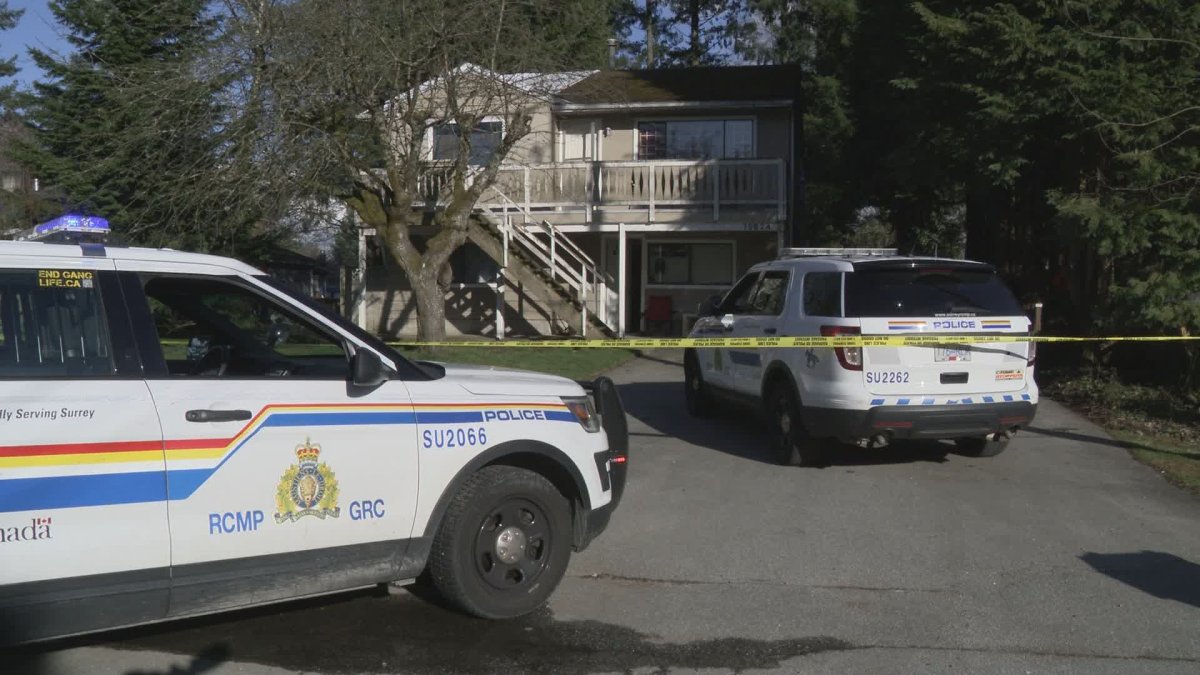 Police investigate a shots fired call at a home in Surrey's Whalley neighbourhood on Friday. 