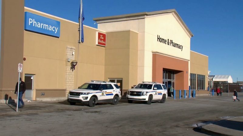 RCMP investigate an armed robbery at the Walmart in Airdrie, Alta. on March 12, 2020. 