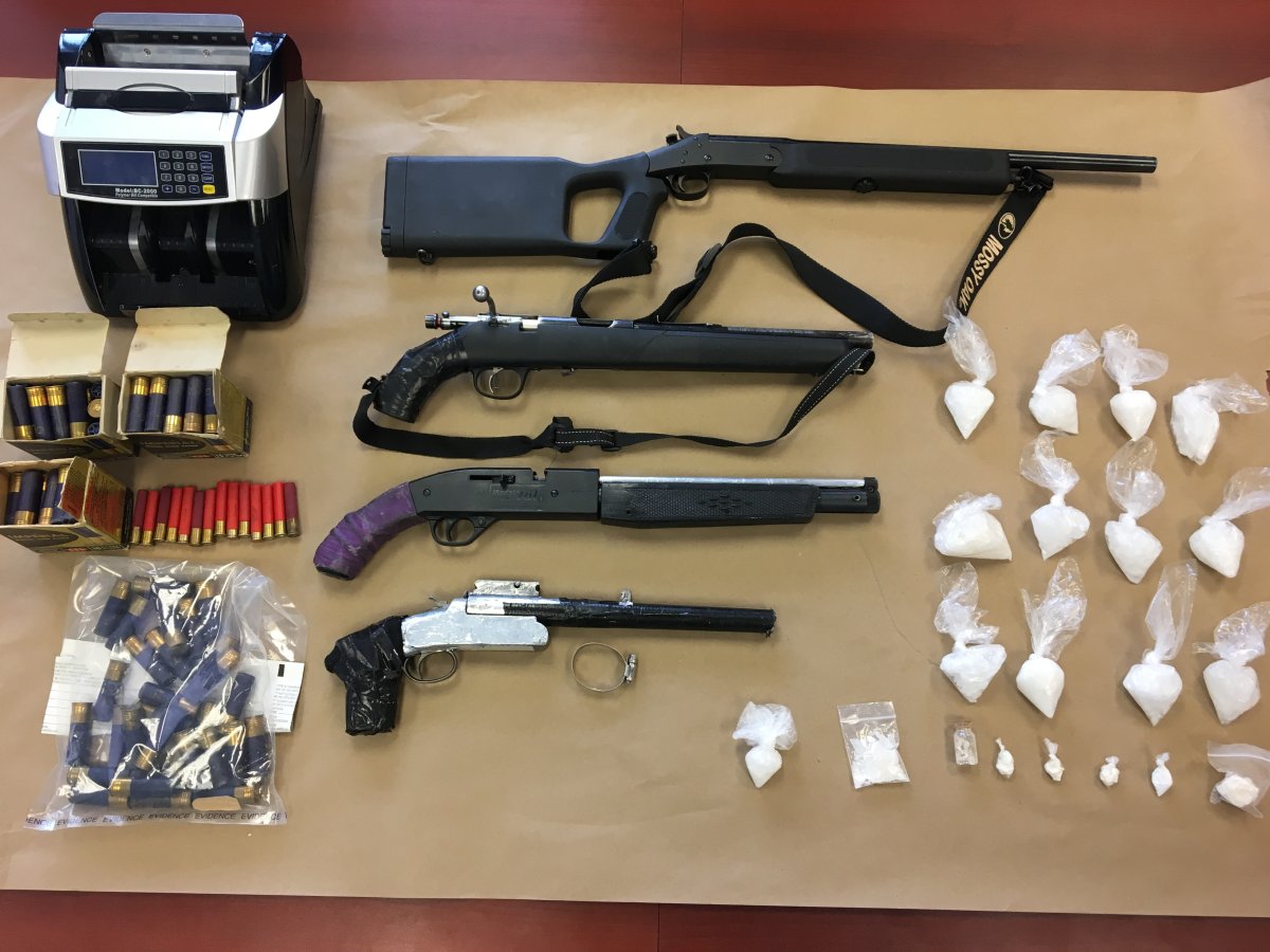 Two people are facing charges after Prince Albert police seized drugs, guns and ammo from a residence on Thursday.