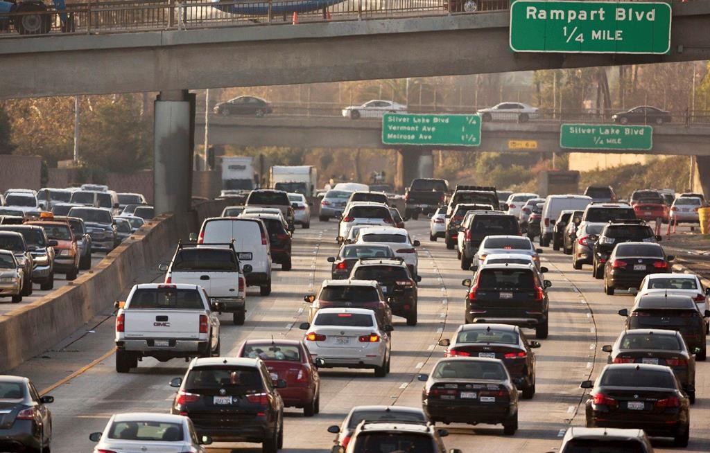 FILE - This Dec. 12, 2018, file photo shows traffic on the Hollywood Freeway in Los Angeles. President Donald Trump's is expected to mark a win in his two-year fight to gut one of the United States' single-biggest efforts against climate change, relaxing ambitious Obama-era vehicle mileage standards and raising the ceiling on damaging fossil fuel emissions for years to come. (AP Photo/Damian Dovarganes, File).