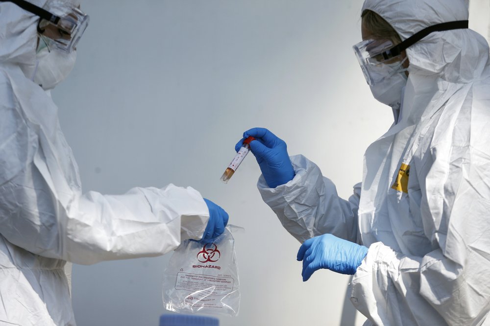 Medical staff of a mobile unit take samples to test for Covid-19, at the Santa Maria della Pieta' hospital complex, in Rome, Wednesday, April 1, 2020. 