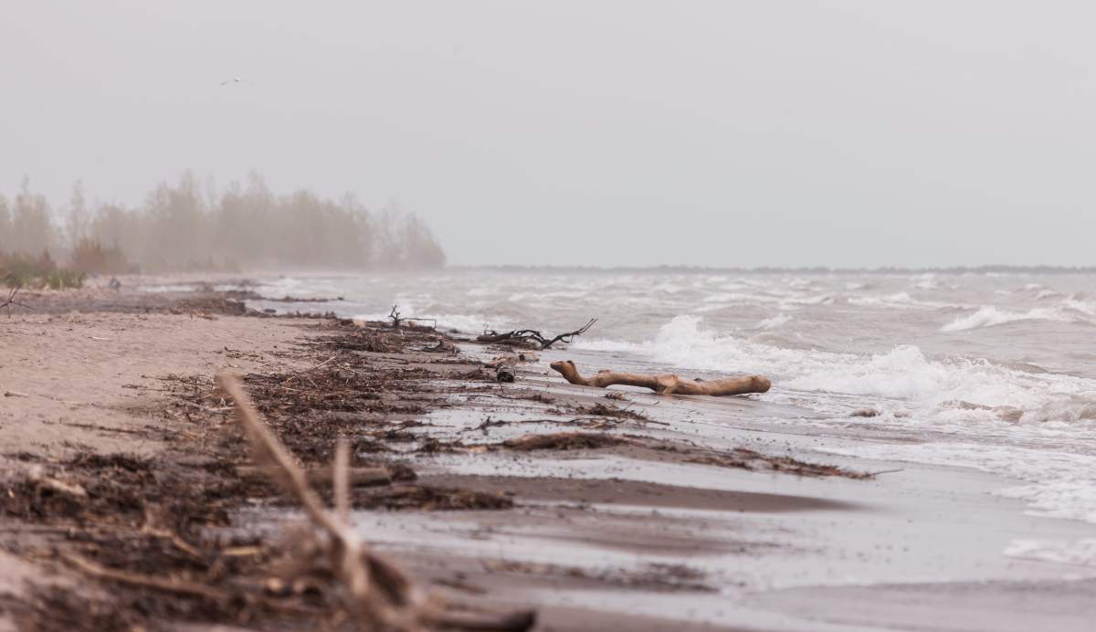 Debris litters the beach at Port Burwell Provincial Park in Port Burwell, Ont., on May 23, 2018.