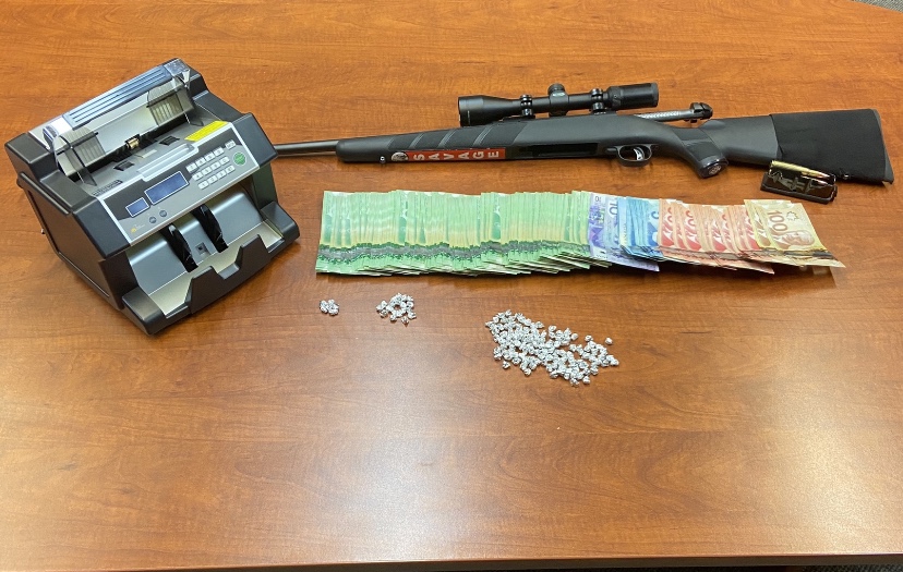 RCMP say crack, cash and a gun were found during a raid at a Dauphin, Man., home on Sunday.