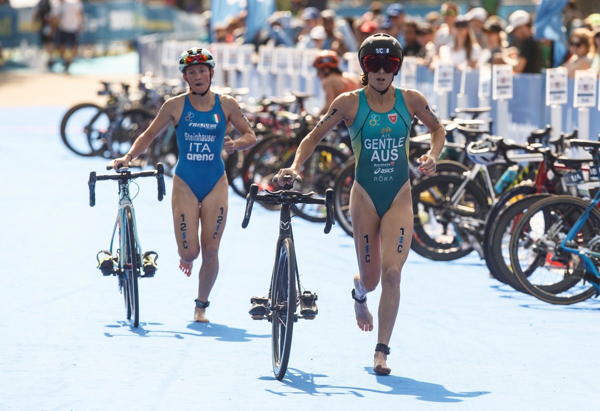 Ashleigh Gentle of Australia is followed by Verena Steinhauser of Italy during the Elite Mixed Relay race at the ITU World Triathlon Series in Edmonton on Sunday, July 21, 2019. THE CANADIAN PRESS/Jason Franson.
